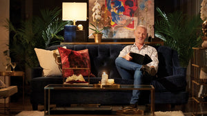 Steven Sabados sitting with products from his Taboo Studio Collection